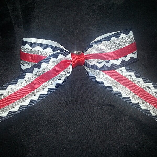 Custom hair bows for fastpitch players and other lady athletes who want to look good. Visit us at http://t.co/PgAMpa99e8