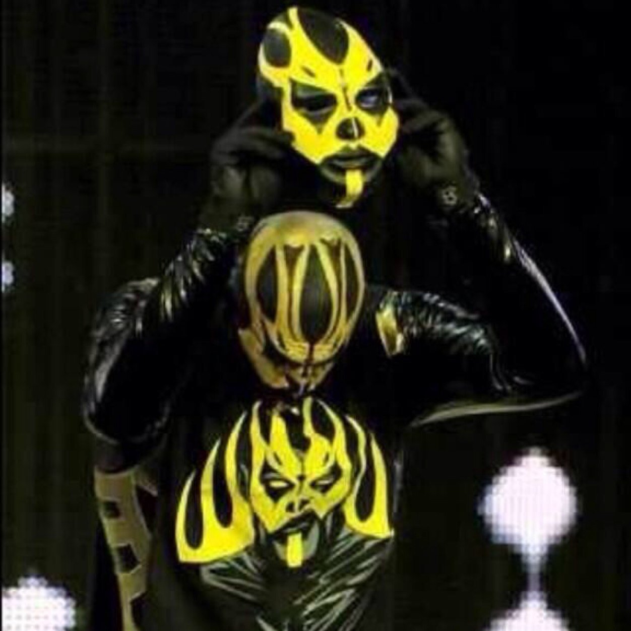 The gold face painting of a man just identifies who he is the ring. Out of the ring he is a normal person. That man is, Goldust. (NOT: @Goldust)