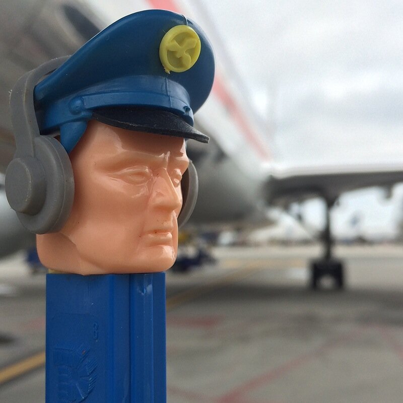 A rare, vintage 1970s PEZ dispenser, enjoying a second career -- as the airline pilot he has always represented.