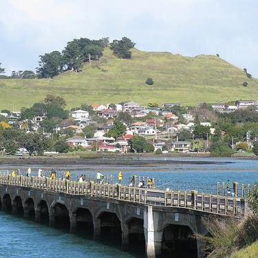 Picturesque village with colourful hanging baskets, nestled between Mangere Mountain, Manukau Harbour and Ambury Regional Park (working farm open to the public)