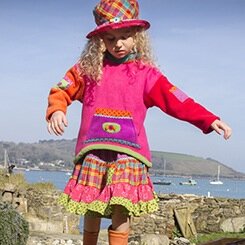 Colourful Cornish clothing stitched beside the sea.