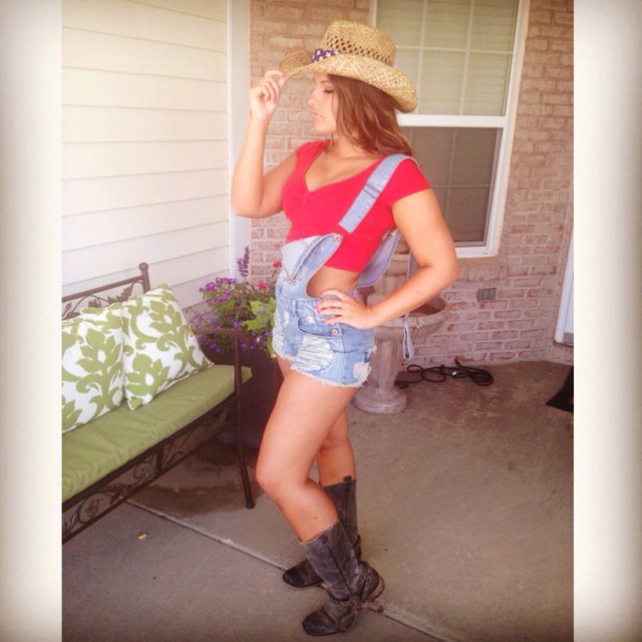 she can wear high heeled shoes, but she'd rather wear cowboy boots, cut off jeans and a baseball hat