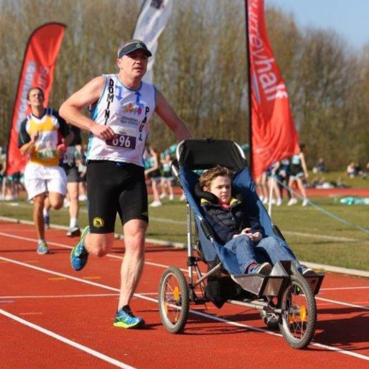 An average runner who pushes his disabled son in distance events