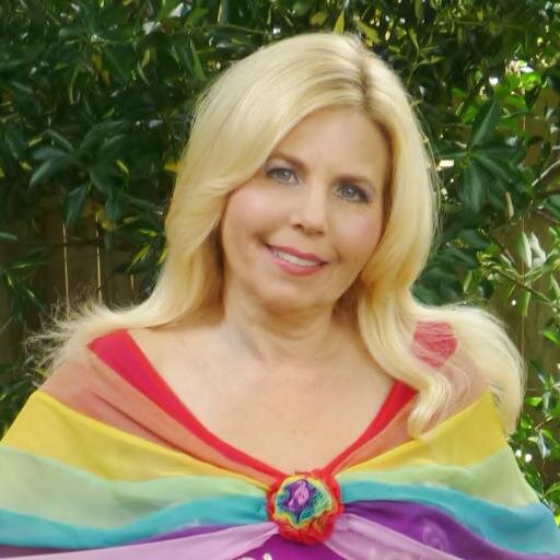 I'm the Lady of the Rainbow, the magical character from my In Your Heart Lives a Rainbow book series of stories & songs
 My goal is to help spread Love & Unity!