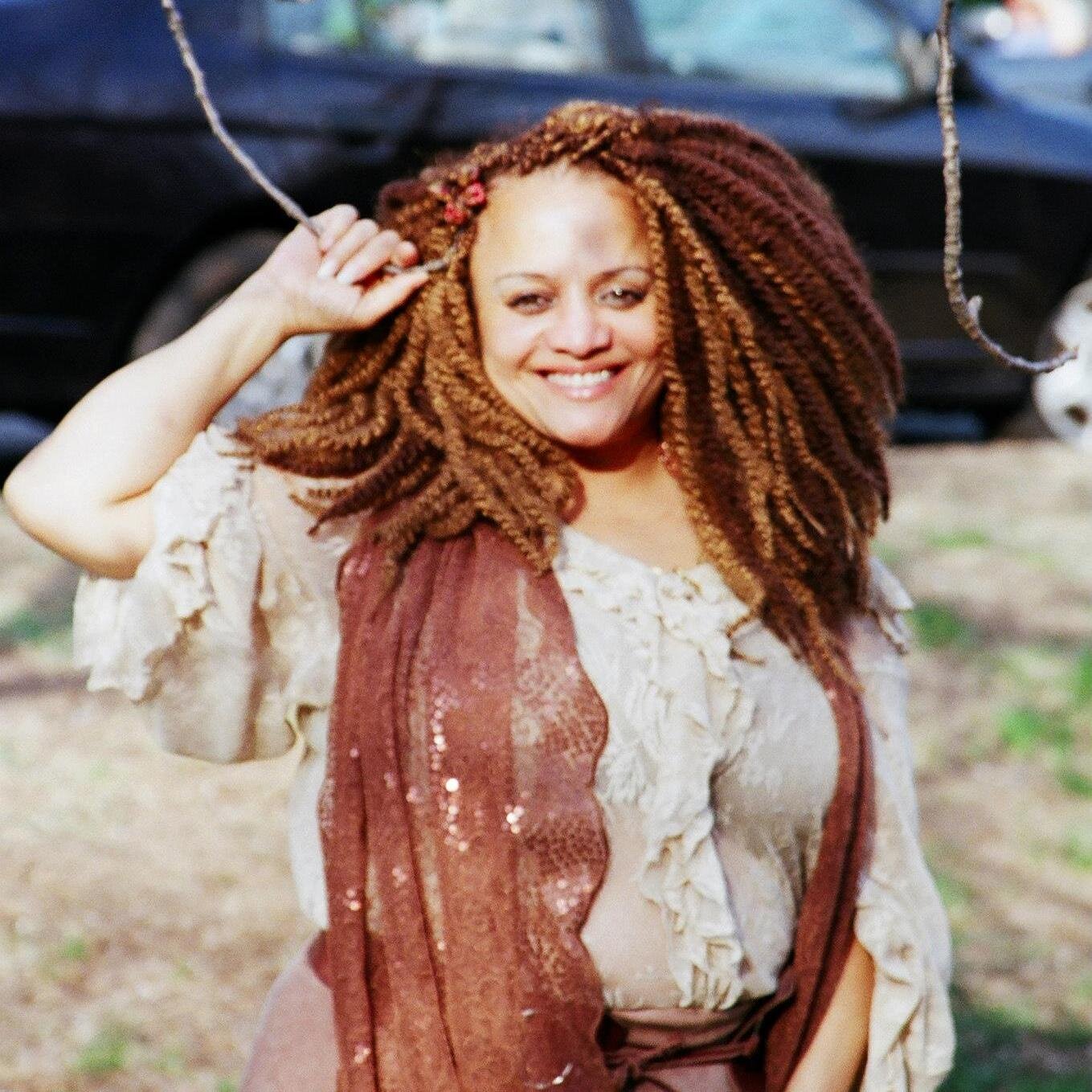 Osun priestess, diviner, poet, photographer, jewelry designer, and above all an evolutionary.