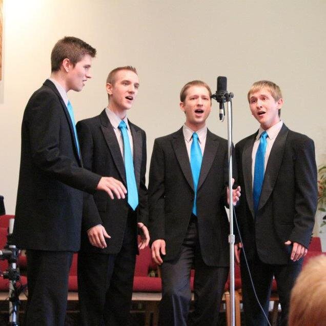 Four brothers expressing their love for harmony through barbershop!