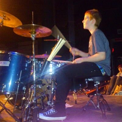 Drummer in Red Bicycle