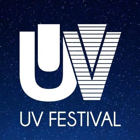 Electronic Music Festival under Ultra Violet lights on New House Farm in Surrey