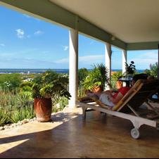 Bonaire Sea View Apartments is a vacation rental with a stunning view overlooking the island & ocean and has a unique tropical garden filled with wildlife.