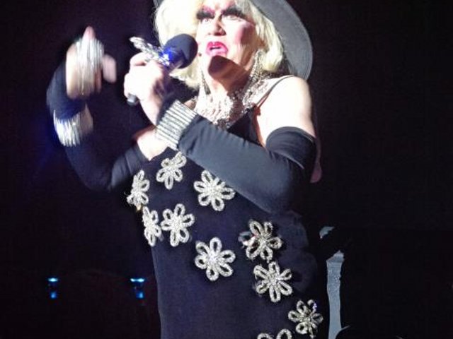 84 year-old female impersonator still vertical, still performing, covered in sequins. Lol
