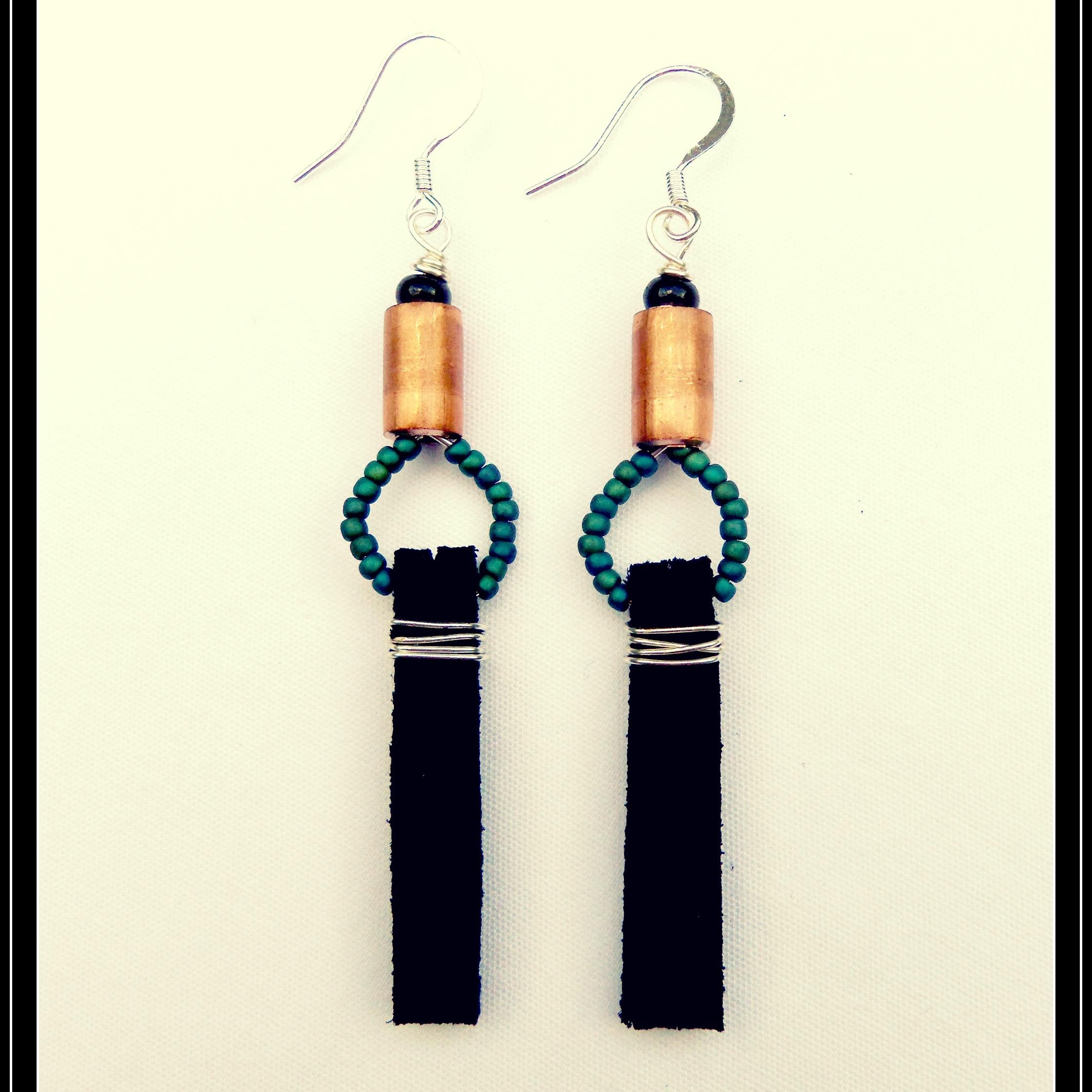 C. Sullivan Designs blends a variety of different materials such as leather, gemstones, felt and metals to create unique wearable art.