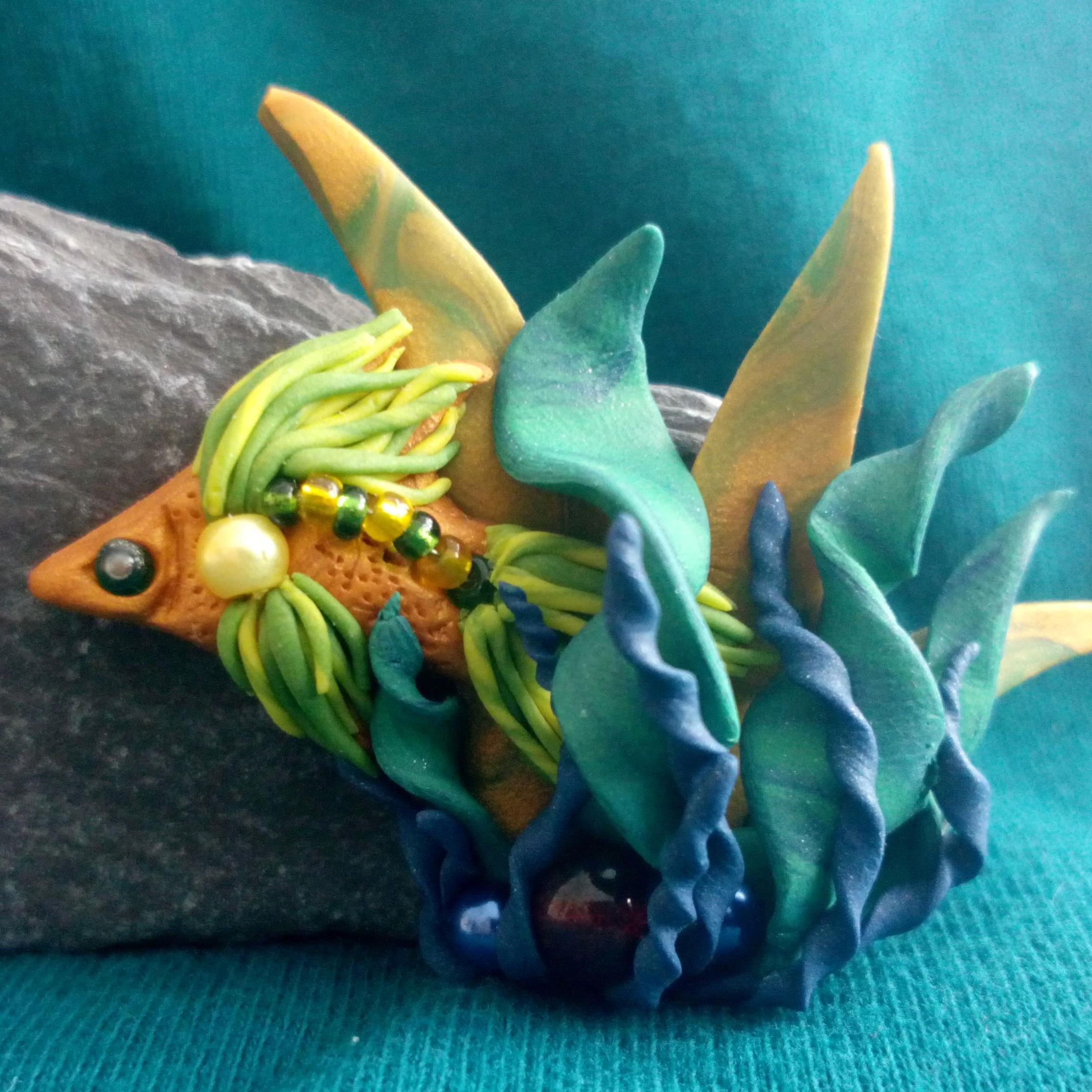 I create unique handmade gifts from polymer clay, incorporating shells, glass beads and stones into my designs.