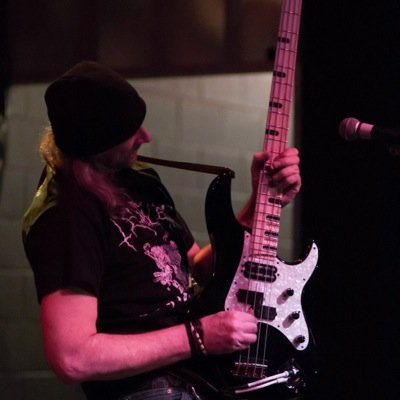 bassist of The Wolf Council, DumpsterJuice, GodCameFromSpace, Bastard Saint, Realm, 911, and formerly of Zebulon Pike. From Milwaukee, lives in Minneapolis