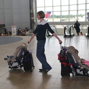 Phoondi Car Seat Trolley - Effortlessly roll your car seat, carry-on luggage, umbrella stroller, and toddler through the airport with one hand.