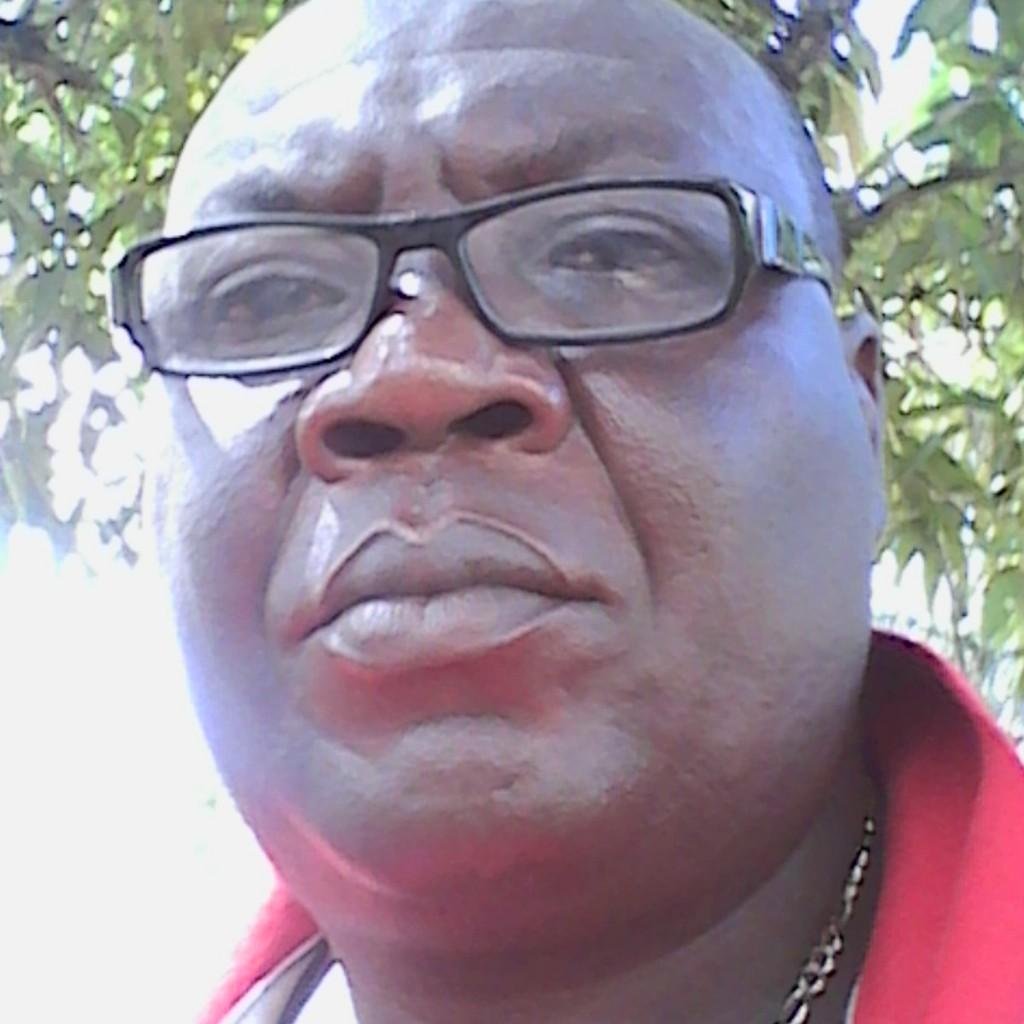 Dark in complexion, brown eyes, 5ft5in