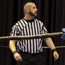 RefereeTom's profile picture. AIW head ref. Heel manager & booker is also on the resume. I’d probably be really successful in life if I hadn’t found out that wrestling schools were a thing.