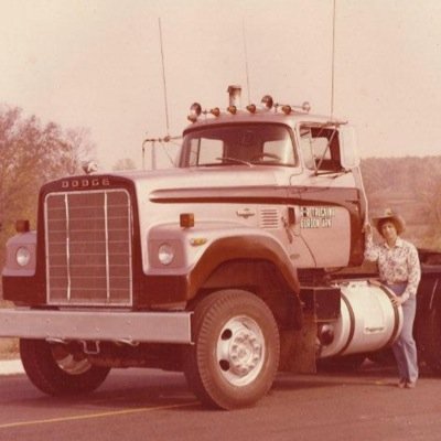 Board member of Real Women in Trucking, lady truck driver, whatever it takes to get the job done, have gun will travel