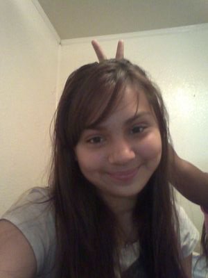 I have brownish blackish hair and like having lots of friends and getting a long with everyone