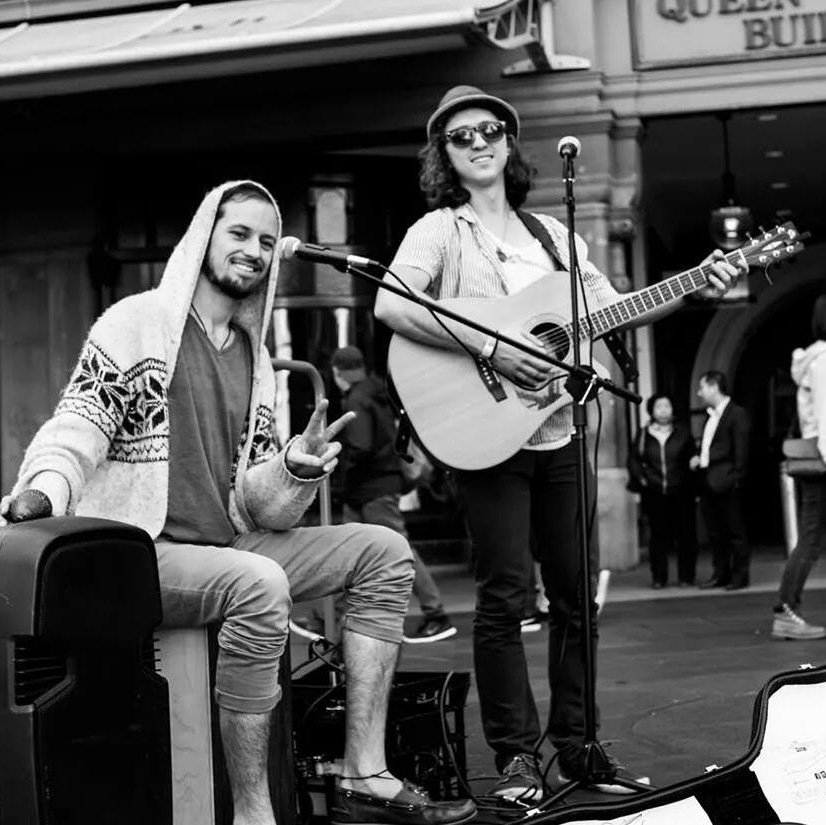 Two inexperienced street performers attempt a world tour with no shows, money or contacts.
Filming and writing the guide to Busking that they didn't have.