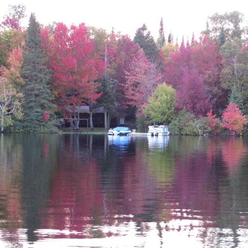 Cottage Rentals on Sand Lake with water trampoline, hot tubs, fireplaces, amazing beach