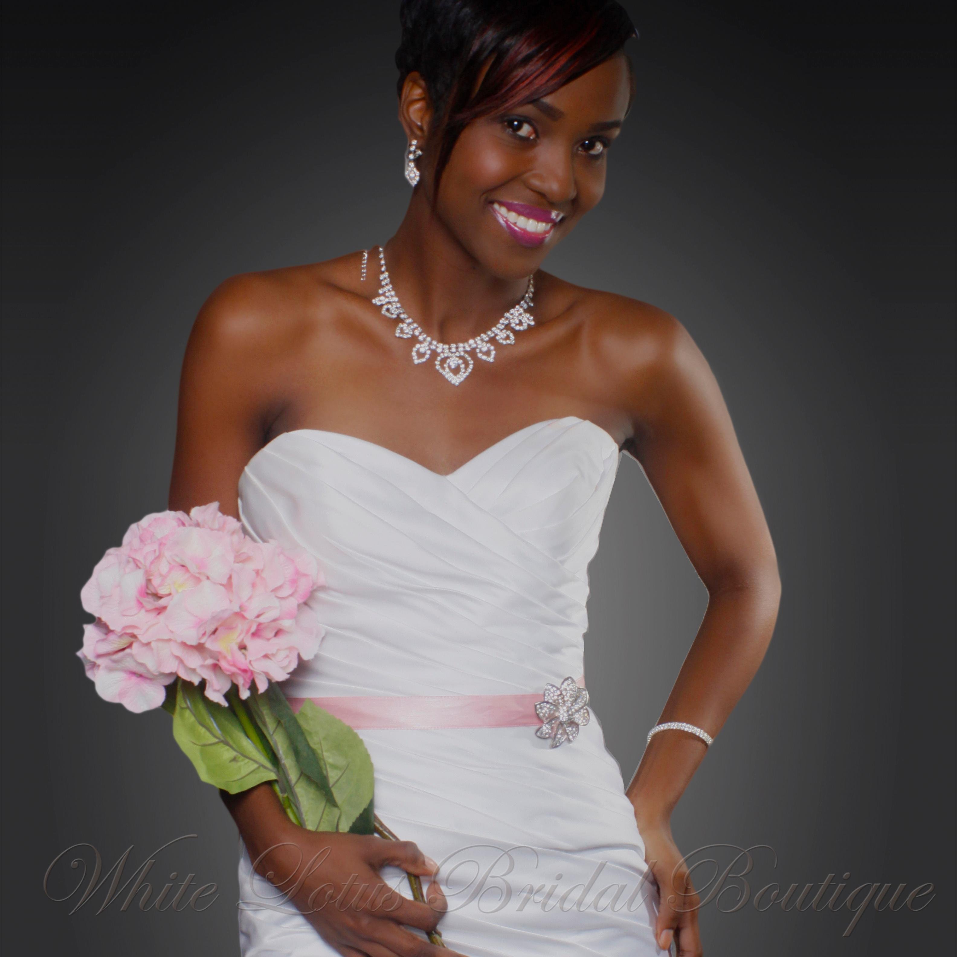 WhteLotusBridal's profile picture. Jamaican-based Bridal Boutique, Design House & Woman-empowering brand. We specialize in handmade bridal accessories, decadent & elegant bridal gowns & more...