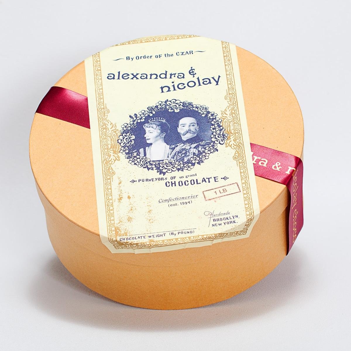 Alexandra & Nicolay signature assorted tin contains creamy truffles, luscious fruits,hazelnuts and honey all enrobed in premium white, dark and milk chocolate.
