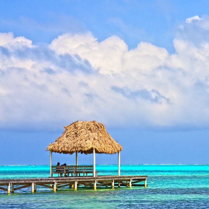 A luxurious cluster of cabanas tucked steps away from the sand in beautiful Belize