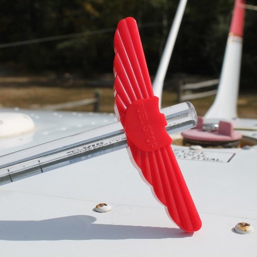 The Fuel Stop is an aviation product that snaps onto a standard plastic straw fuel gauge and prevents it from slipping into the tank or rolling off the wing.