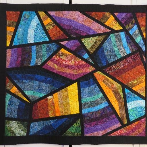 As a retired fine artist I have discovered the joy of creating with fabric rather than paint. I enjoy quilting in both traditional and my own abstract patterns.