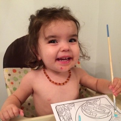 I am a spunky little toddler who enjoys stroller rides, doggies, painting, and cookies!
