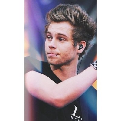 Might be punk rock. Lead singer of 5SOS.