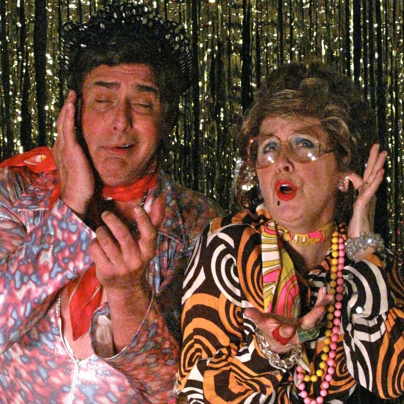 m_and_o_show's profile picture. Martini & Olive are a hilariously unhip Comedy Lounge duo! Come on feel their noize- and, see their SwizzleStick Dancers...