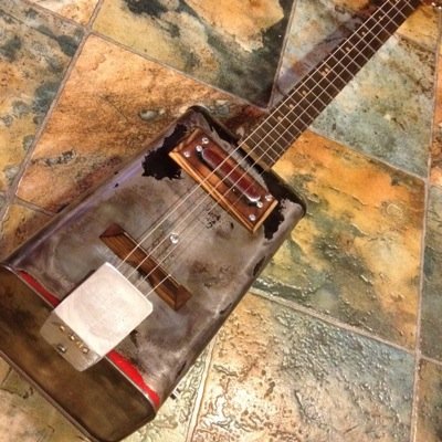 I build handmade guitars from gas and oil cans truely a custom highly playable instrument. They are not cookie cutter guitars. Imported from Best Virginia.