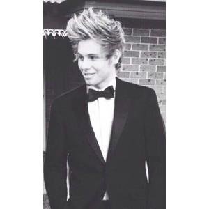 just a low life person who cries whenever she sees a picture of 5 Seconds of Summer in school or anywhere.