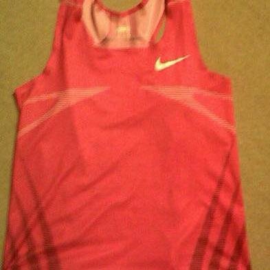 The pink vest is motivation to move. It symbolises the WEAKNESS of the boy’s performance in the previous session, resulting in COMPULSARY bearing of the vest.