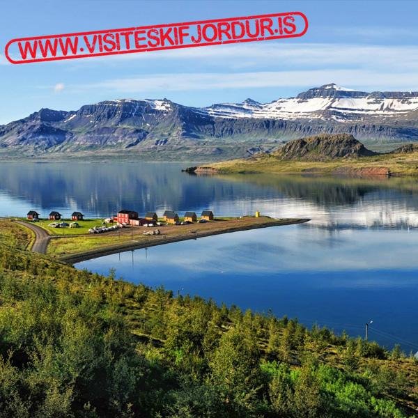 Eskifjordur is a fjord on the east coast of Iceland, beautiful town with old houses, hiking trails around the rivers and waterfalls in surrounding mountains.