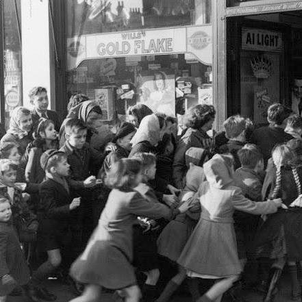 History teacher, book reader, bocce player, hopeful story slammer. These children above are celebrating the end of sugar rationing in the early 1950s UK- yay!