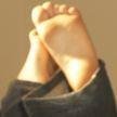 Just a bloke who loves females who are tickled on video, female feet (particularly in sandals) and */f tickling generally. And chocolate. Not a sub.