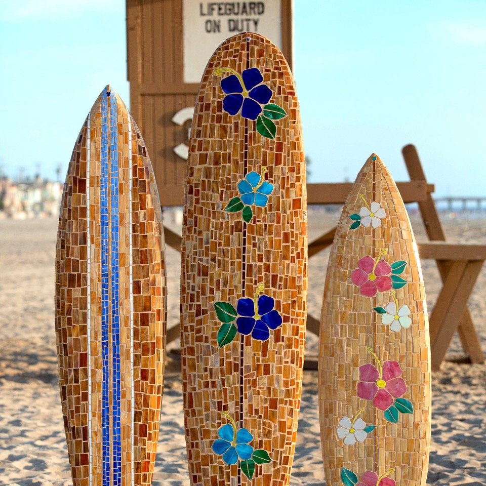hand cut vibrant glass tile individually placed onto recycled surfboards & more!