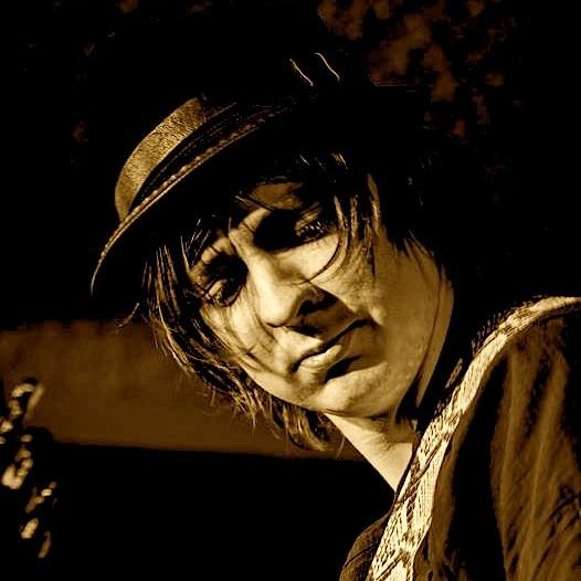 Blues singer/guitarist, Passionate Barista, Cafe Manager.