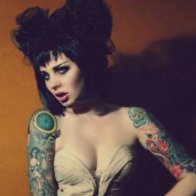 Singer, model, spookshow, geek, twisted showgirl, tattooed rock n roller, latex lover, scouser and professional zombie.