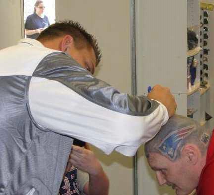 I have Tom Brady helmet tattoos on my head I have green dot I have moss signuter and gronk and wes welker my goal is to get the coach and Brady tis sign I'm in