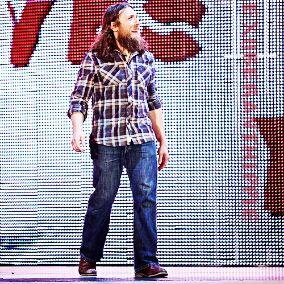 A man who is always determine in anything he does. Got a group of people shouting the word YES with him. Also, he's sorta of a hippie. That man is Daniel Bryan.
