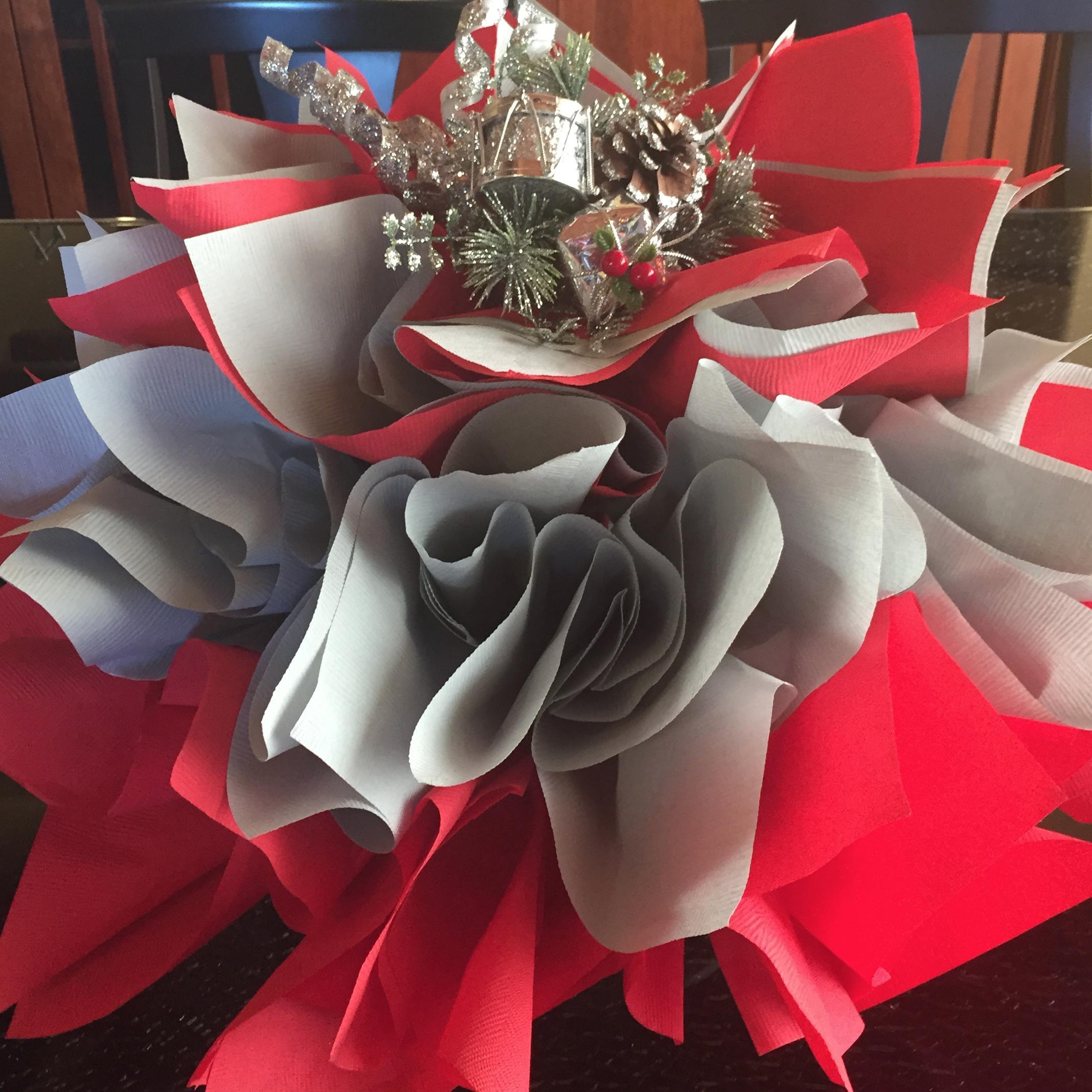 The NapkinTree is fun and functional centerpiece idea that's a paper napkin holder. Make your own creation by placing paper napkins in the NapkinTree using