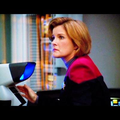 I am Captain Kathryn Janeway of the Federation Starship Voyager. How may I be of service?
