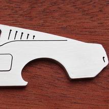 stainless steel bottle openers in the shape of cool cars & zipper pulls/key chains in the shape of race tracks. Made in the USA