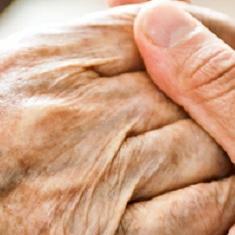 A daughter caring for her two elderly parents at home.