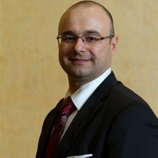 Christopher M. Koitsis, family man, sales professional, and sports enthusiast.