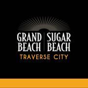 Fun in the sand Sugar & Grand, #traversecity's premier #beach front resorts. Located in Grand #Traverse East Bay. Call (800) 968-1992 or (800) 509-1995.