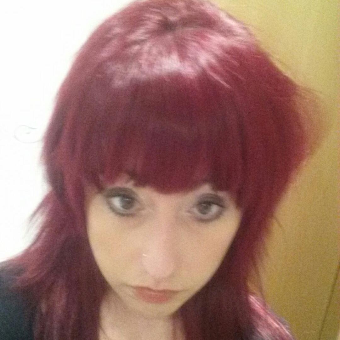 Compassionate caring pink haired  crazy puppet loving vegan.